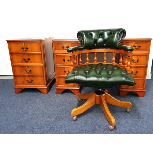 267 - YEW VENEER KNEEHOLE DESK AND CAPTAIN'S CHAIR
the desk with an inset leather effect top above an arra... 