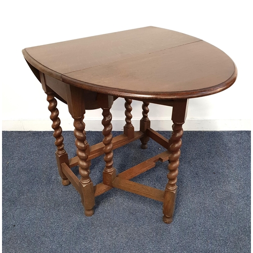 271 - OAK GATELEG TABLE
with shaped drop flaps, standing on barley twist supports, 71.5cm wide