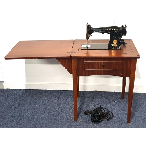 275 - MAHOGANY CASED SINGER ELECTRICIAL SEWING MACHINE
with a fold out action, serial number EC644432, sta... 