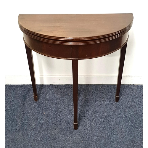 281 - MAHOGANY DEMI LUNE OCCASIONAL TABLE
with a fold over top, standing on tapering supports with spade f... 