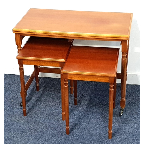 MCINTOSH MAHOGANY OCCASIONAL TABLE
with a rectangular fold over top above two pull out occasional tables, on reeded supports, 60cm high