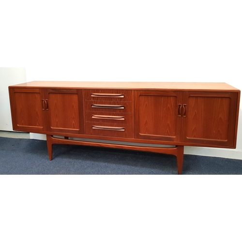 294 - G PLAN TEAK SIDEBOARD
with four central drawers flanked by a two pairs of panelled cupboard doors, s... 