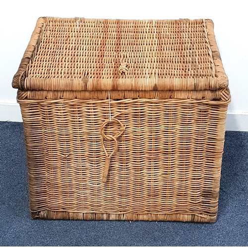 307 - WICKER LAUNDRY BASKET
with a lift up lid and cut out side carry handles, 59.5cm x 70cm x 56cm