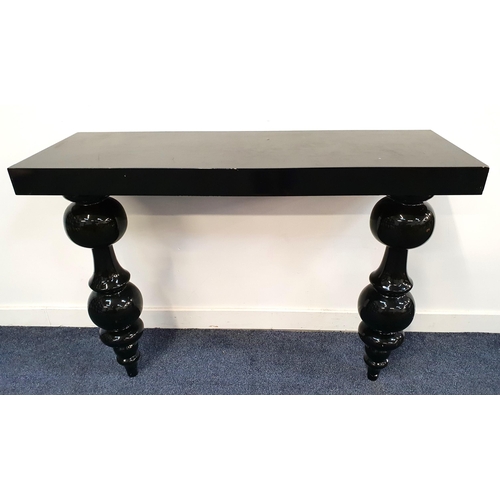 BLACK PLASTIC CONSOLE TABLE
with a rectangular top, standing on bulbous turned supports, 80cm x 115cm x 40cm