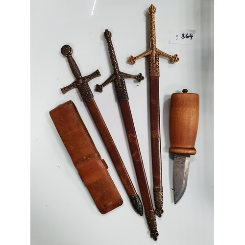 THREE MINIATURE SWORDS
possibly by Denix; together with a wooden handled knife in leather sheath
Note: You must be over the age of 18 to bid on this lot