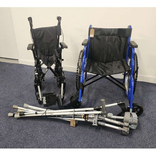 43 - TWO WHEELCHAIRS AND A SELECTION OF 9 CRUTCHES AND WALKING AIDS