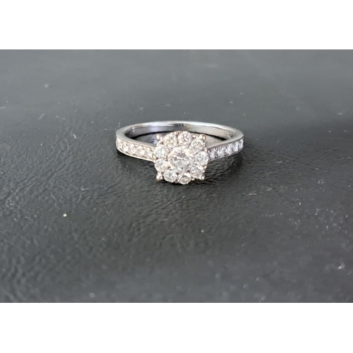 82 - DIAMOND CLUSTER RING
the central round brilliant cut diamond approximately 0.25cts, in nine diamond ... 