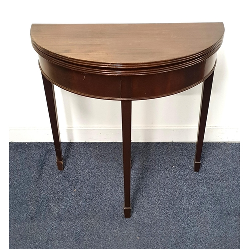 MAHOGANY DEMI LUNE OCCASIONAL TABLE
with a fold over top, standing on tapering supports with spade feet, 76cm high