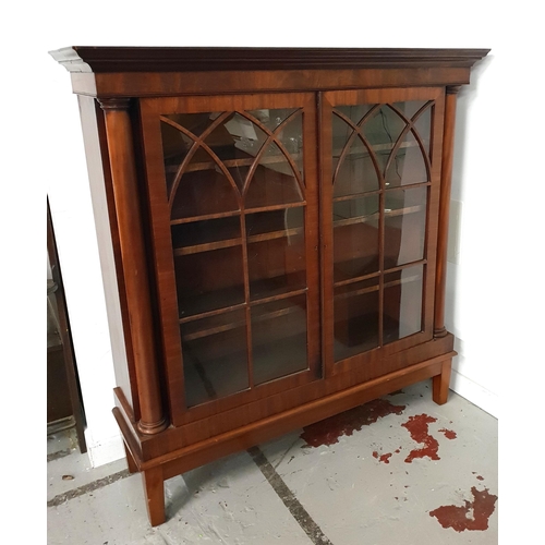EARLY 20th CENTURY MAHOGANY BOOKCASE
with a stepped moulded top above a pair of glass panel doors opening to reveal adjustable shelves, on a later base with stout supports, 149cm x 142cm x 41cm