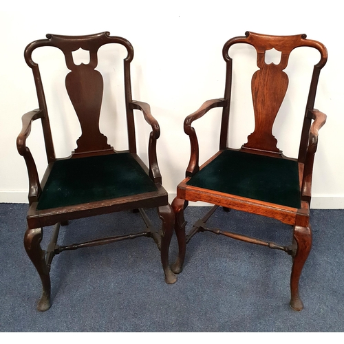PAIR OF GEORGE II OAK ARMCHAIRS
with a shaped and pierced back above a vase splat and shepherd crook arms, with drop in seats, standing on cabriole front supports united by an 'H' stretcher (2)
