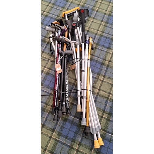 SELECTION OF TWENTY WALKING AIDS, STICKS AND CRUSTCHES