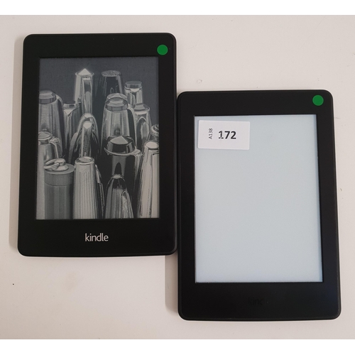 172 - TWO AMAZON KINDLE E-READERS
comprising a Paperwhite 3, serial number G090 G105 7207 06F3; and a Pape... 