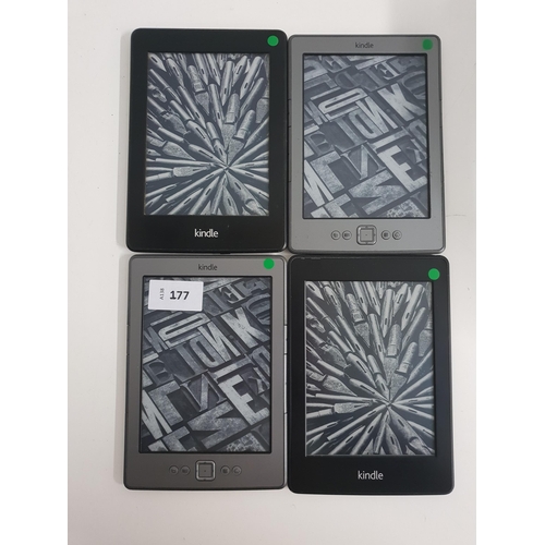 177 - FOUR AMAZON KINDLE E-READERS
comprising a Paperwhite 2, serial number 90D4 2204 3436 02BN (with stic... 