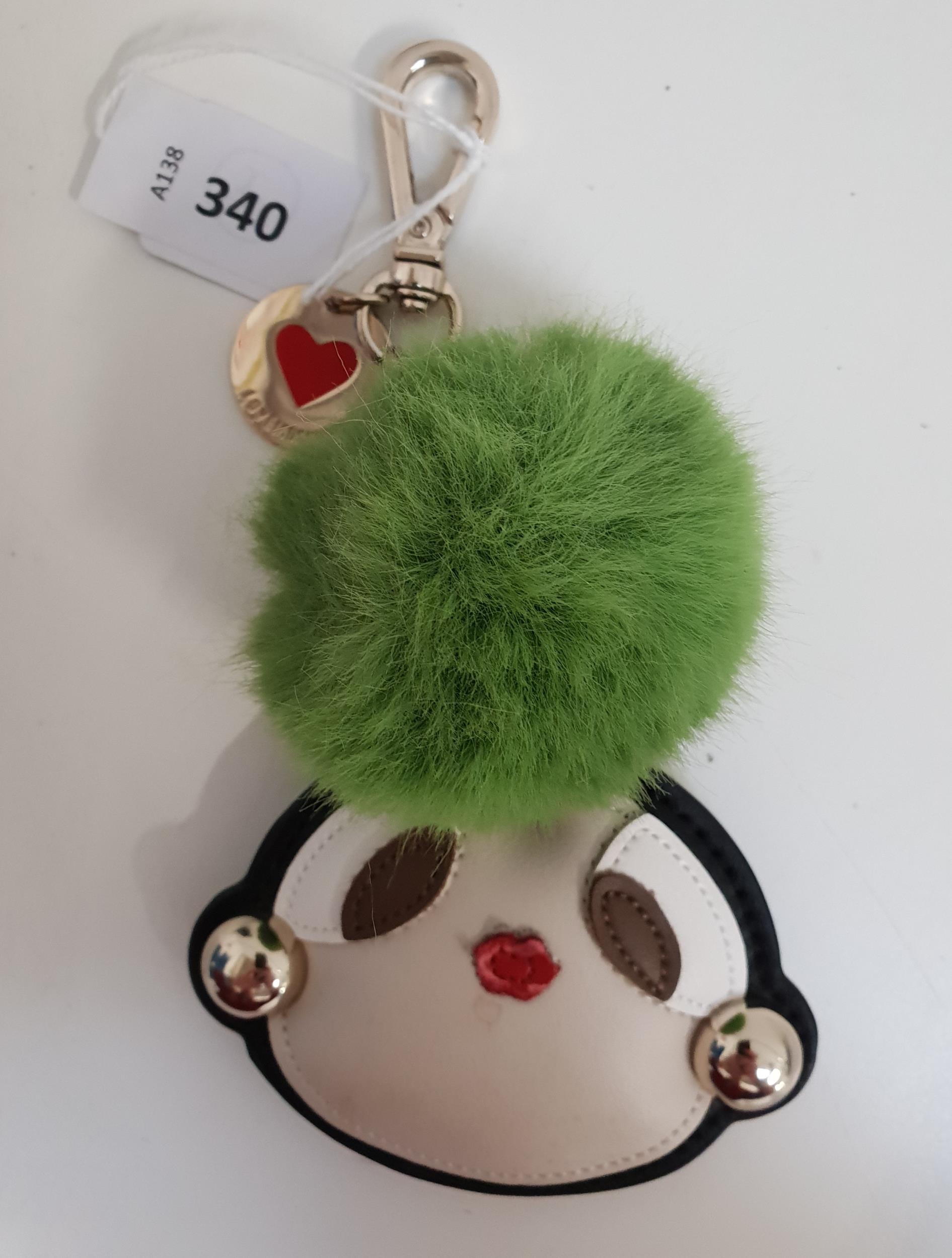 LOVE MOSCHINO DOLL KEAY CHAIN with green pompom. Slight damage to lips