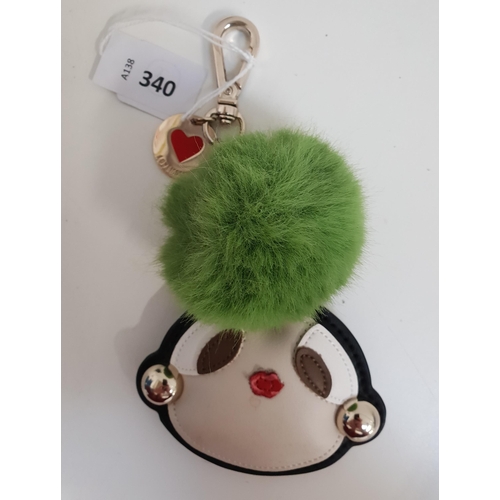 LOVE MOSCHINO DOLL KEAY CHAIN 
with green pompom. Slight damage to lips