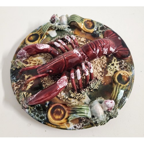 PORTUGUESE PALISSY MAJOLICA WALL PLATE
decorated with a lobster on the sea bed among coral, 19cm diameter