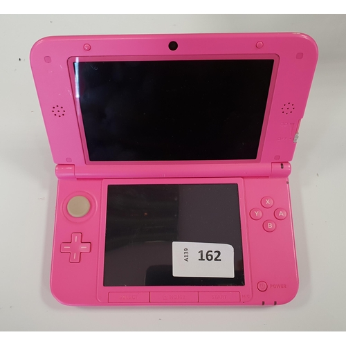 162 - NINTENDO 3DS XL HANDHELD GAMES CONSOLE
serial number SUH104595549, wiped; with 42 All-Time Classics ... 