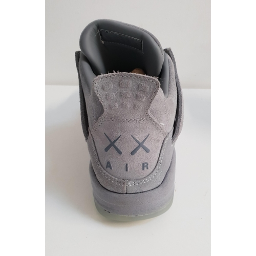 199 - PAIR OF KAWS X NIKE AIR JORDAN 4
in cool grey, UK size 9