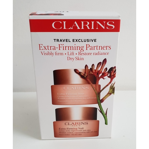 NEW AND BOXED CLARINS EXTRA FIRMING PARTNERS
Travel exclusive, Day and Night (both 50ml)