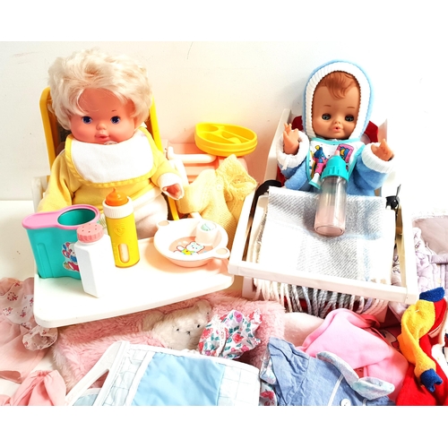296 - TWO BOXES OF DOLLS
and dolls clothes, including a Fisher Price high chair with folding tray, a Carry... 