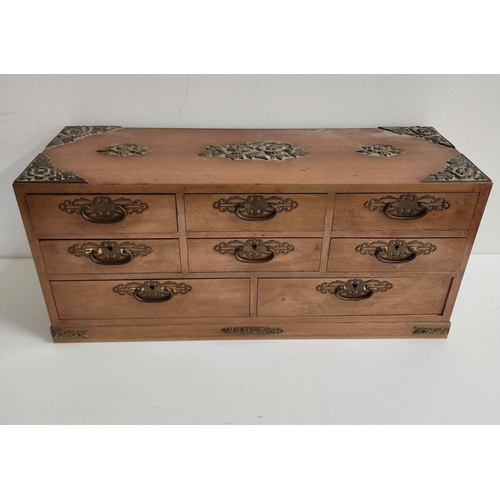 243 - CHINESE TABLE TOP TEAK COLLECTORS CABINET
with brass floral decoration and corner mounts, with side ... 