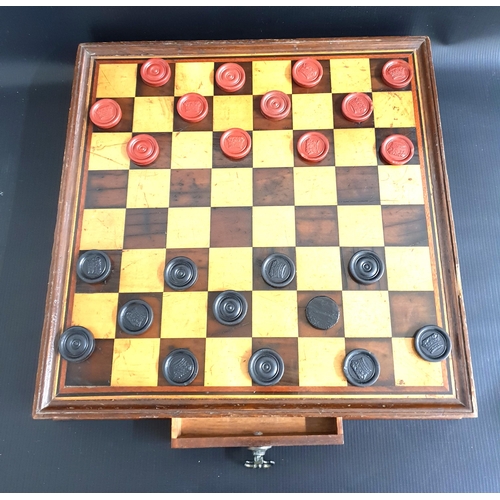 290 - TABLE TOP MAHOGANY DRAUGHTS/CHESS BOARD
with a frieze drawer containing draughts