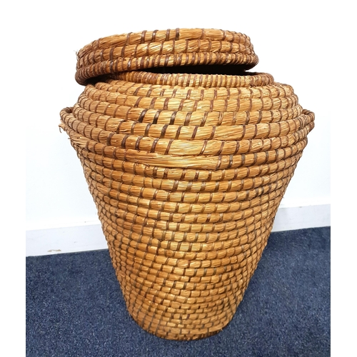 255 - ALIBABA WICKER LAUNDRY BASKET
of tapering form with a circular lid and side carrying handles, 60cm h... 