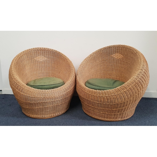 PAIR OF RATTAN BALL ARMCHAIRS
with shaped rounded bodies and loose seat cushions (2)