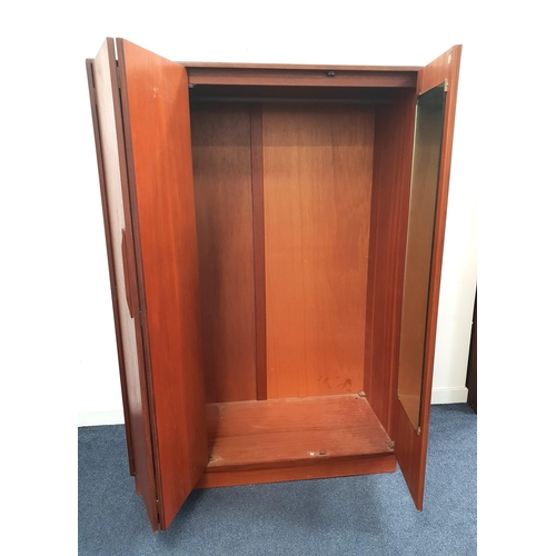 353 - G PLAN TEAK WARDROBE
with two doors opening to reveal a hanging rail, shelves and drawers, standing ... 