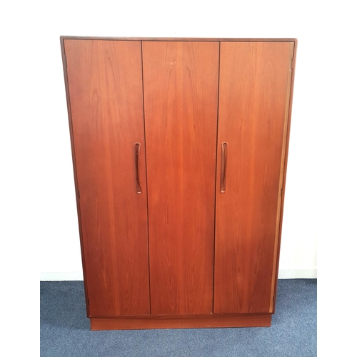 354 - G PLAN TEAK WARDROBE
with a pair of sliding fold back doors and a single door opening to reveal a ha... 