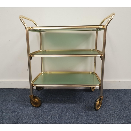 374 - CAREFREE GILT METAL TROLLEY
with three tiers, the top tier being a removeable tray, standing on cast... 