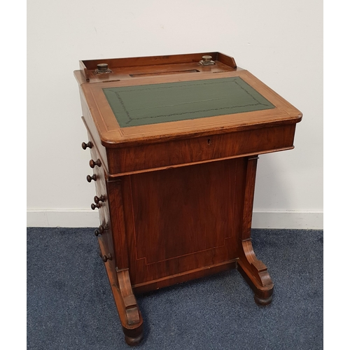 378 - VICTORIAN WALNUT DAVENPORT
with a three quarter galleried top with two glass ink bottles and a pen t... 