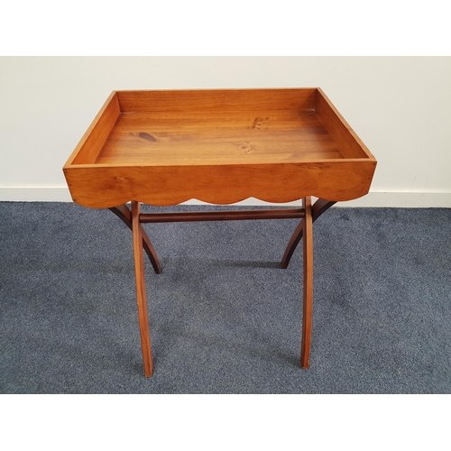 396 - TEAK BUTLERS TRAY
with a shaped frieze and side carry handles, on a folding stand, 74.5cm x 58.5cm x... 