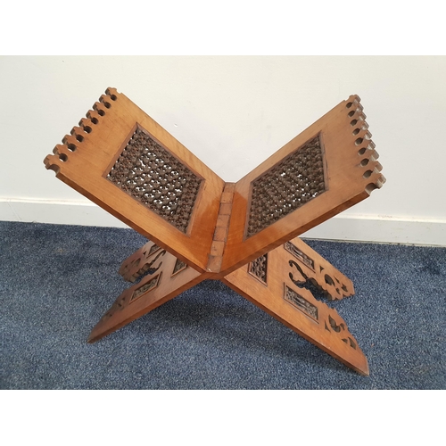 397 - ISLAMIC QURAN STAND
of folding X frame design with carved pierced and turned panels, 54cm x 46cm