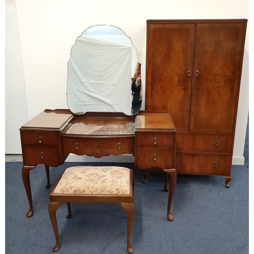 409 - BEITH WALNUT WARDROBE AND DRESSING TABLE
the wardrobe with a pair of doors opening to reveal hanging... 