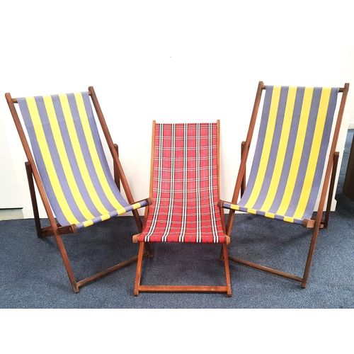 410 - TWO TRADITIONAL FOLDING DECK CHAIRS
with blue and yellow striped fabric, together with a similar fol... 