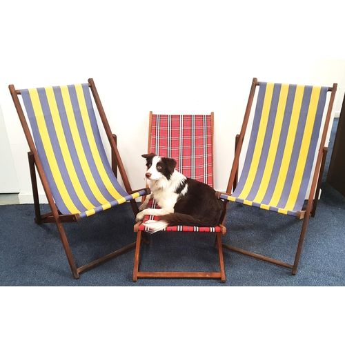 410 - TWO TRADITIONAL FOLDING DECK CHAIRS
with blue and yellow striped fabric, together with a similar fol... 