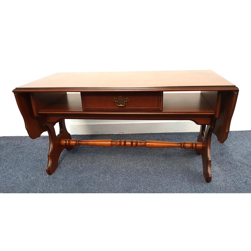 405 - CHERRY LOW SOFA TABLE
with shaped drop flaps and frieze drawer, standing on shaped supports united b... 