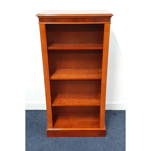 YEW AND CROSSBANDED BOOKCASE
with a moulded top above a moulded dentil frieze,  with four shelves enclosed by fluted columns, standing on a plinth base, 122cm x 61cm x 28cm