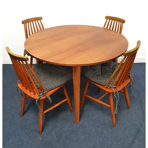 411 - ELM CIRCULAR DINING TABLE AND FOUR CHAIRS
the table standing on tapering supports, 107cm diameter, t... 