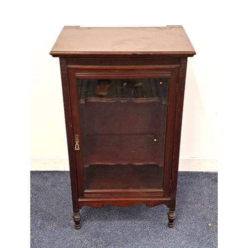 362 - EDWARDIAN MAHOGANY MUSIC CABINET
with a panelled glass door opening to reveal a shaped shelved inter... 