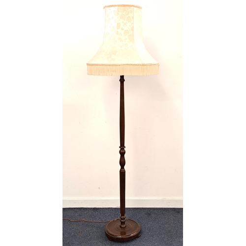 420 - MAHOGANY STANDARD LAMP
raised on a circular base with a turned column and a shaped damask shade, 188... 