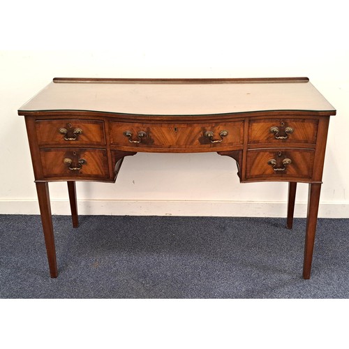 MAHOGANY SERPENTINE KNEEHOLE DESK
with a raised back above an arrangement of five crossbanded drawers, standing on tapering supports, 81cm x 122cm x 50cm
