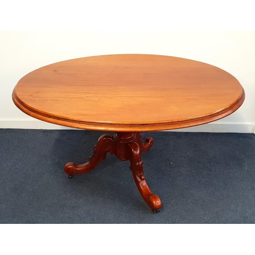 LATE VICTORIAN MAHOGANY LOO TABLE
with an oval tilt top standing on a turned column with three outswept supports with porcelain casters, 138cm wide