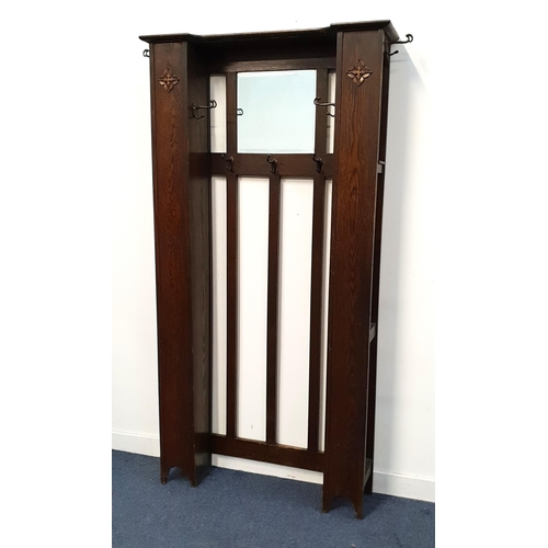 429 - ART DECO OAK HALL STAND
in the style of Liberty & Co, with a central bevelled rectangular mirror wit... 