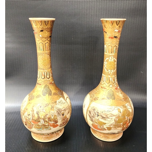 PAIR OF JAPANESE SATSUMA BOTTLE VASES
decorated with figural and floral panels, 24cm high (2)