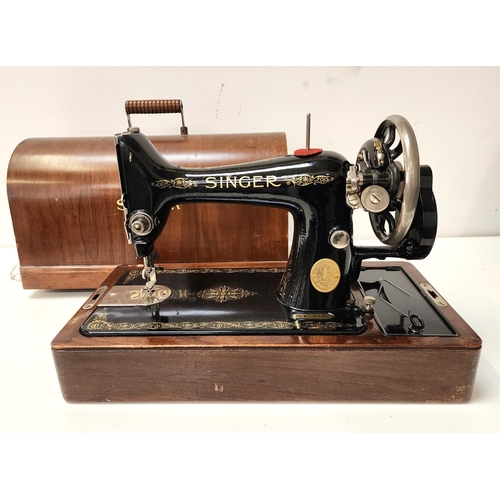 VINTAGE SINGER SEWING MACHINE
in a wooden case, numbered Y8436564