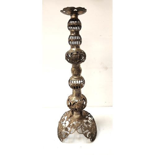 356 - ORNATE BRASS PILLAR CANDLE STICK
with pierced decoration, raised on a shaped tri-form base, 71cm hig... 