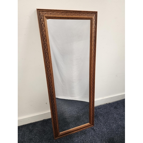 415 - RECTANGULAR WALL MIRROR
in a carved frame with a plain plate, 100.5cm x 39.5cm