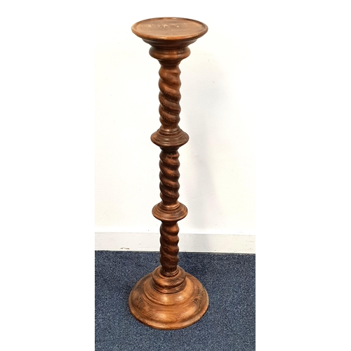 445 - OAK TORCHERE
with a circular base and barley twist column, 99.5cm high